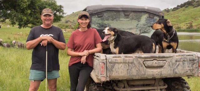 image of couple and dogs next to ute