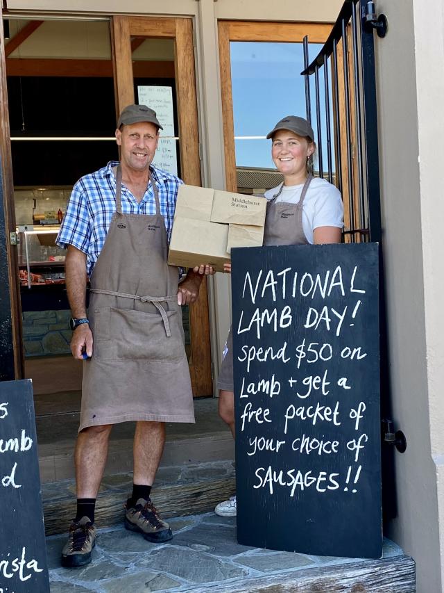 image of two people with national lamb day sign