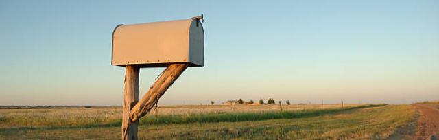 image of mail box infront of farm