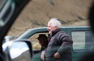 image of two farmers talking outside of ute