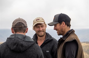 image of three male farmers laughing outside
