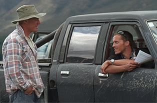 two farms talking inside ute