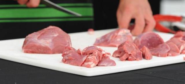 Cutting chunks of meat
