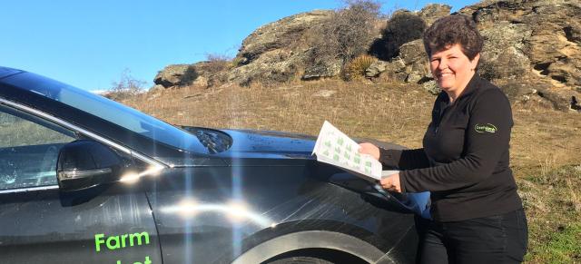 image of B+LNZ staff member infront of branded car