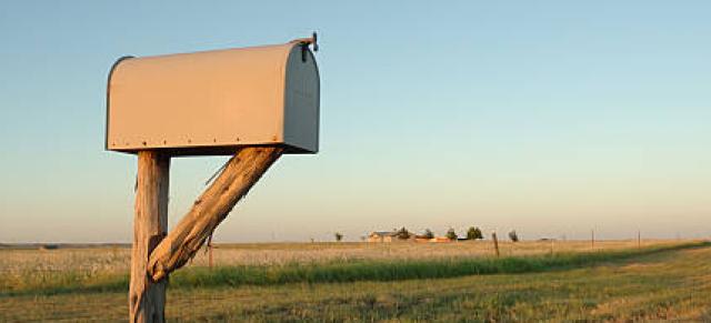 image of mail box infront of farm