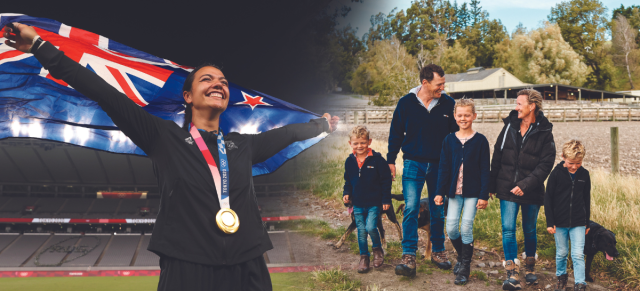 1. An olympian proudly holds a flag while standing with a family and children. 2. A woman holds a flag next to a family and children. 3. A woman stands with a family and children, holding a flag.