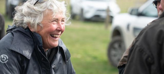 image of older woman at field day laughing