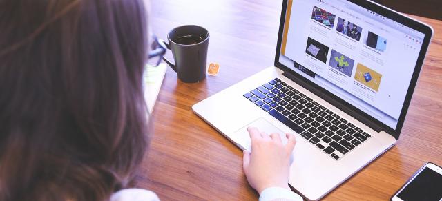 image of female farmer at laptop