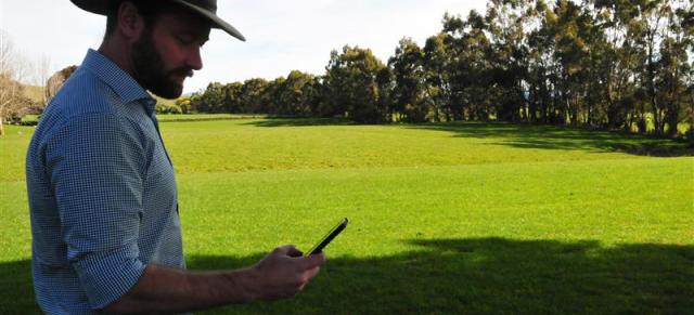 image of farmer using phone