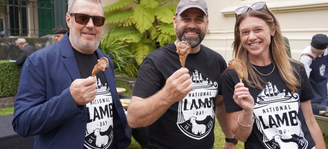 image of national lamb day sponsors at BBQ holding lamb shanks