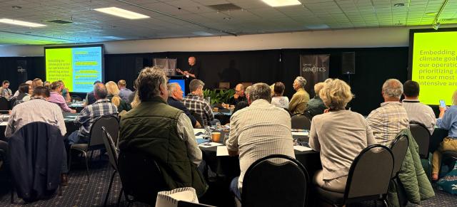image taken from Genetics Forum of audience watching presentation