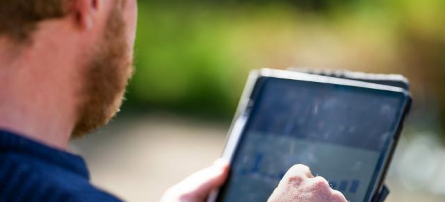 image of farmer using ipad
