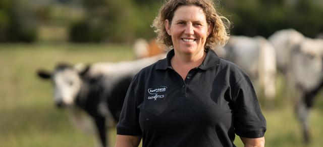 image of Sonya Shaw infront of dairy cows