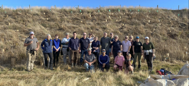 Image of catchment group infront of dry pastures