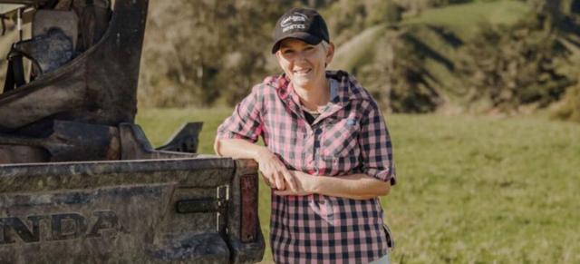 image of Natasha Cave on farm standing by ute