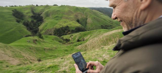 image of man using cellphone for virtual fencing