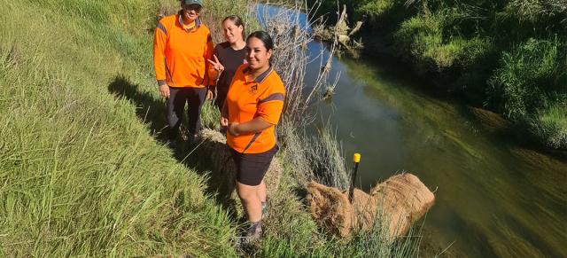 Image of Whangara catchment group members by river