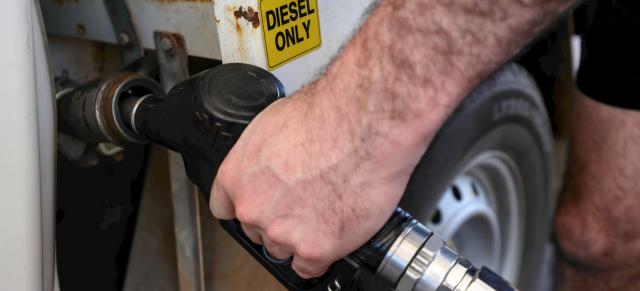 farmer putting gas in ute
