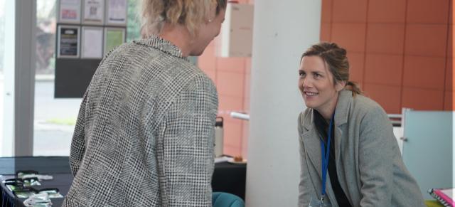image of two women at registration desk