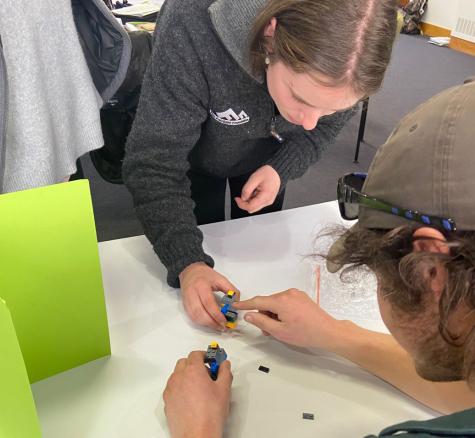 image of gen next graduates playing with lego