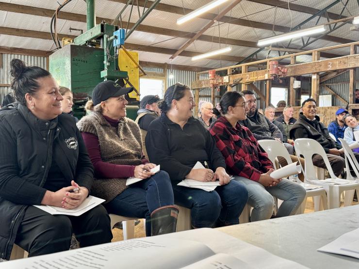 attendees listening to speaker at field day