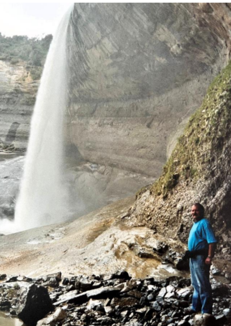 image of woman by waterfall