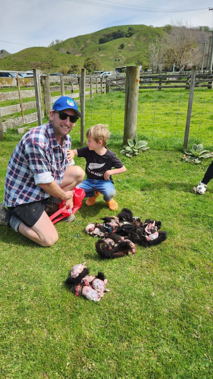 image of catchment member and son next to pests