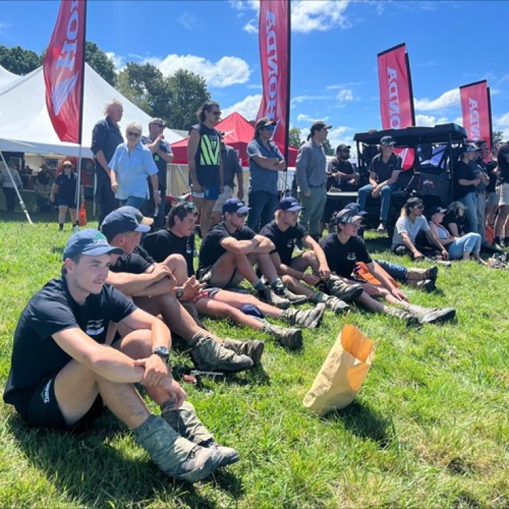 image of students sitting on bank at field days