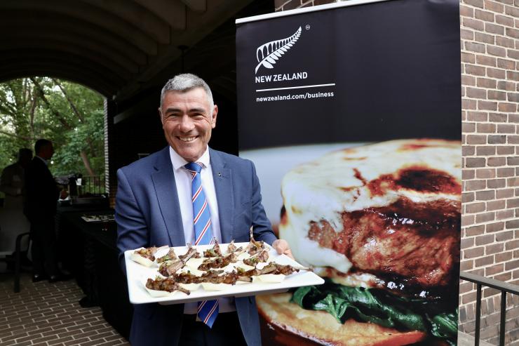 Image of Nathan Guy serving lamb chops