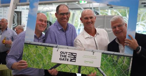 image of B+LNZ staff at Out the Gate conference standing behind sign