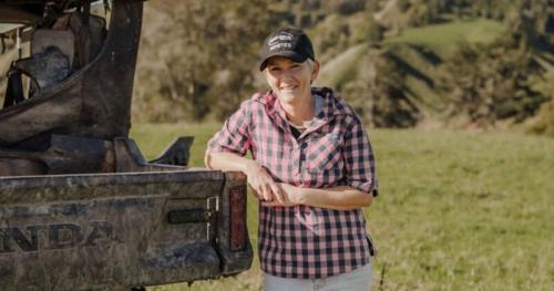 image of Natasha Cave on farm standing by ute