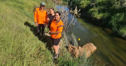 Image of Whangara catchment group members by river
