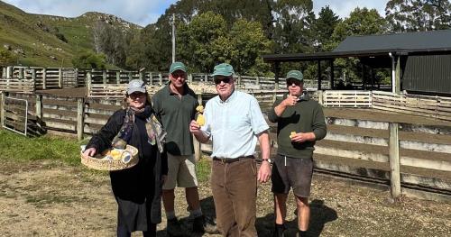 image of councillors at farm carrying basket 