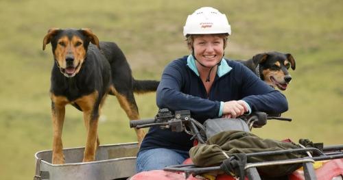 image of Anne Munro with her dogs on bike