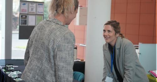image of two women at registration desk