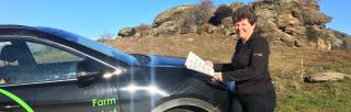 image of B+LNZ staff member infront of branded car