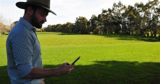 image of farmer using phone