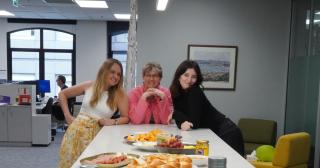 image of Zowie Ransfield, Dionne and Holly around B+LNZ Wellington office kitchen