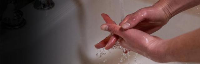 image of person washing their hands