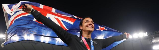 image of Stacey Waaka carrying NZ flag