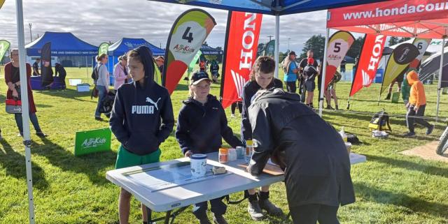 image of agriKids participants signing up at table