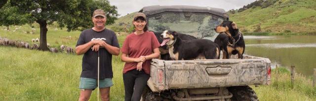 image of couple and dogs next to ute