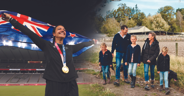 1. An olympian proudly holds a flag while standing with a family and children. 2. A woman holds a flag next to a family and children. 3. A woman stands with a family and children, holding a flag.
