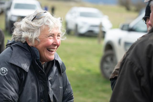 image of older woman at field day laughing