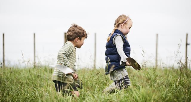 image of boy and girl in field