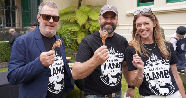 image of national lamb day sponsors at BBQ holding lamb shanks