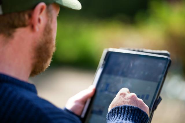 image of farmer using ipad