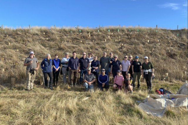 Image of catchment group infront of dry pastures