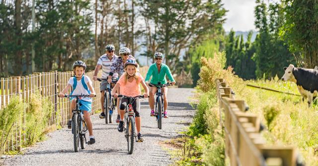 image of family cycling on new coastal cycle trail