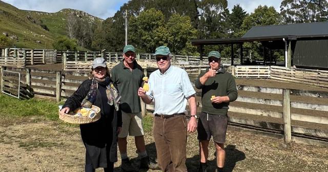 image of councillors at farm carrying basket 